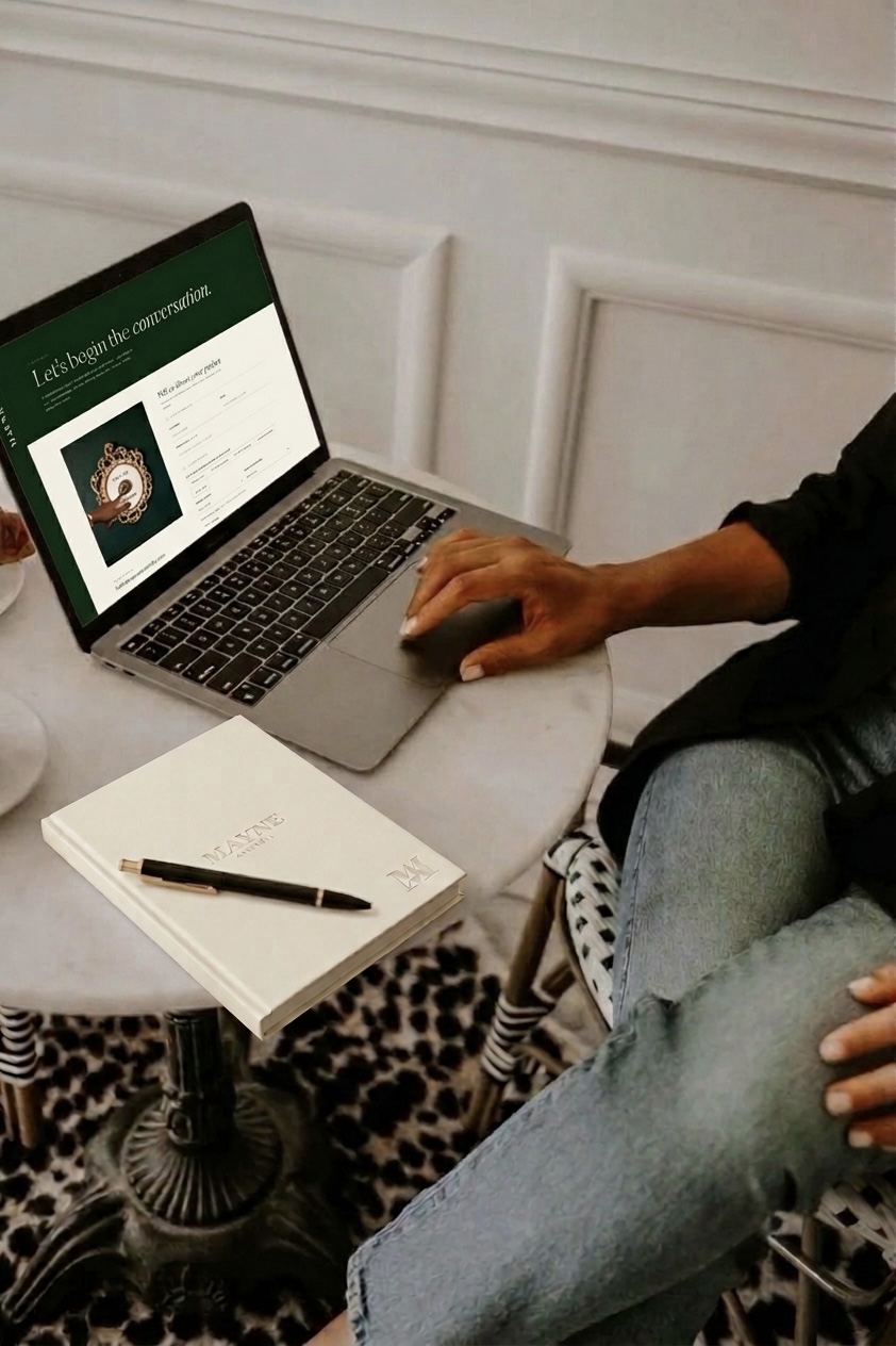 Sending an enquiry to Mayne Assembly from a laptop, notebook and pen alongside