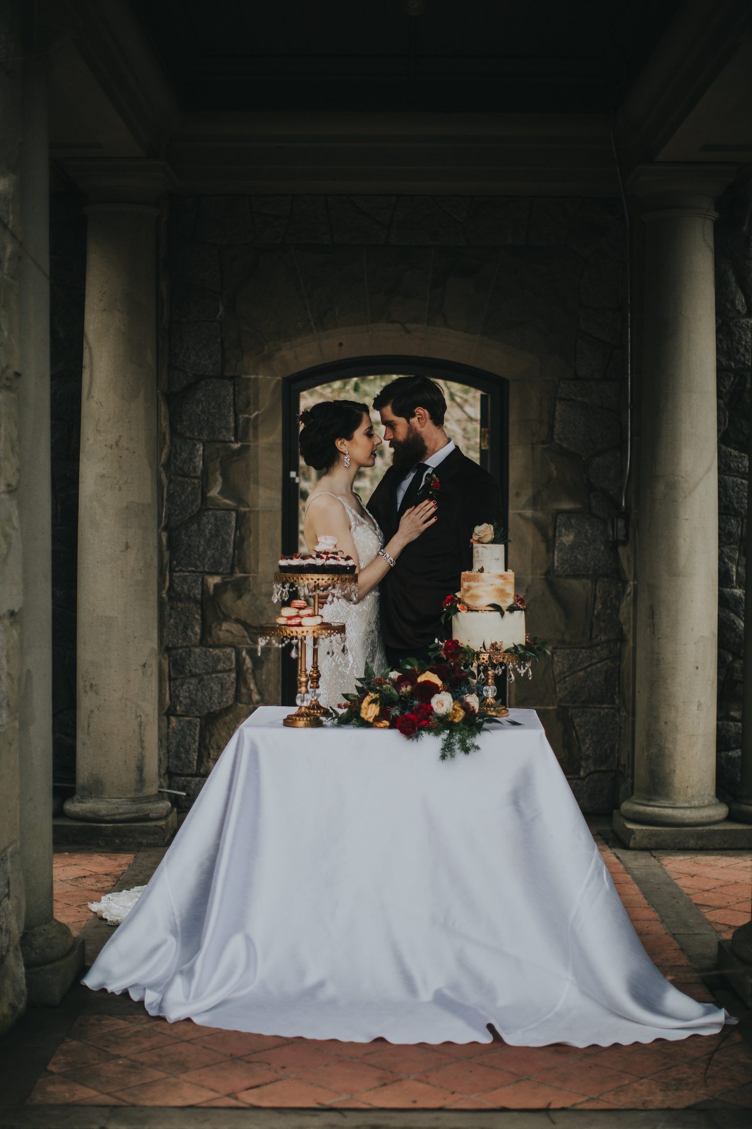 Bridal gown detail — close-up against castle interior