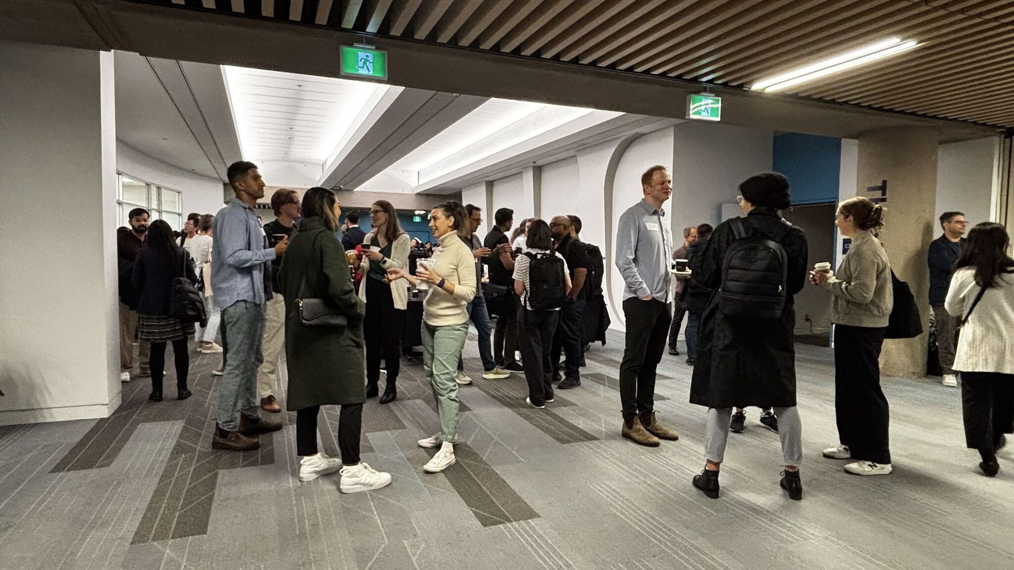Attendees networking during a break between sessions at the ProductBC Conference.